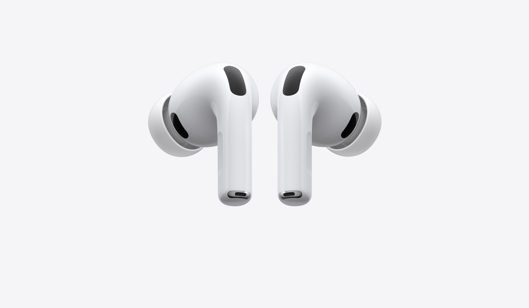 AirPods Pro 3，展示配有硅胶耳塞的左右两只白色无线耳机